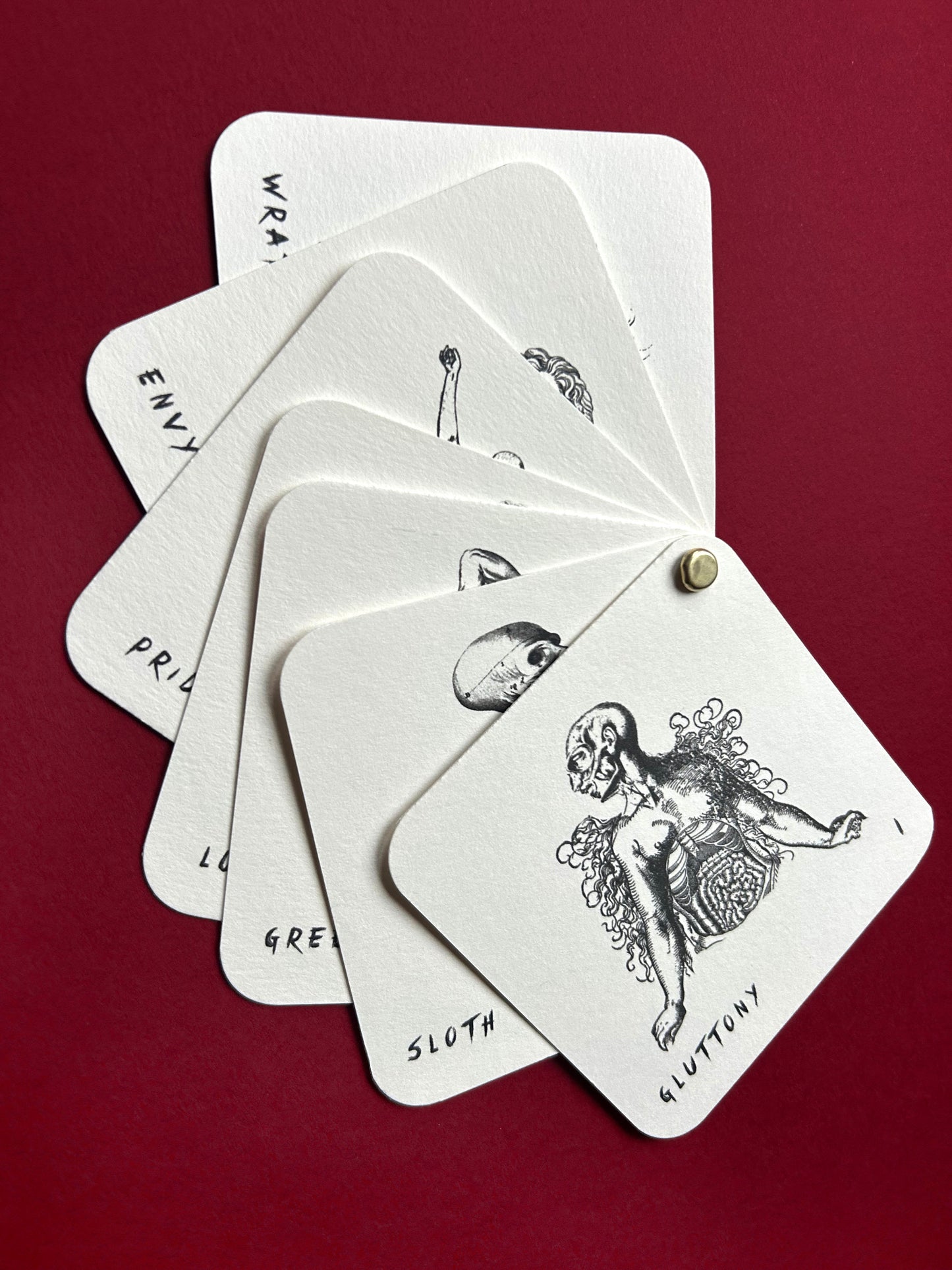 Set of cards with black and white illustrations on a red background This limited edition Se7en print pack is a tribute to David Fincher’s iconic masterpiece. Each set includes three fine art prints, a seven mini print booklet, a small metronome card and a collector’s sticker. This is all handmade and printed by myself.