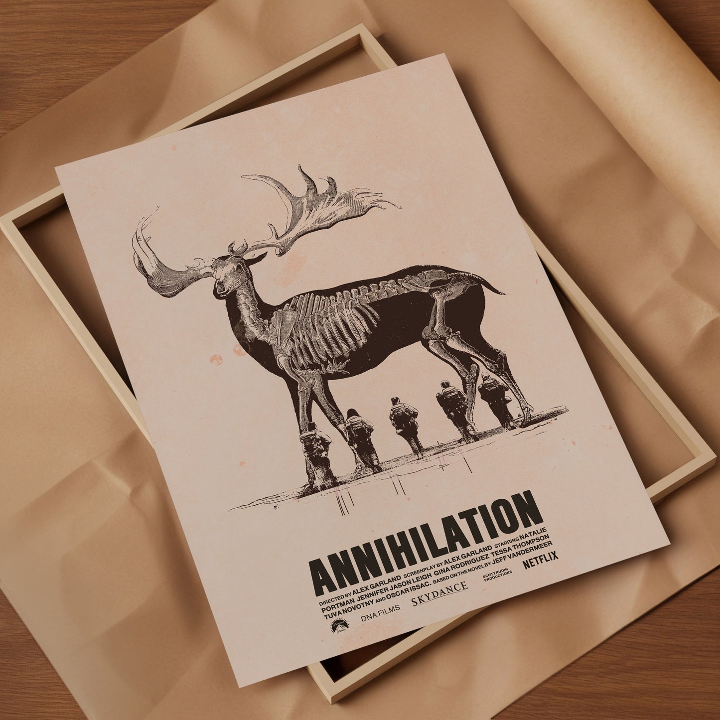 Poster of 'Annihilation' with a deer skeleton and four figures on a beige background