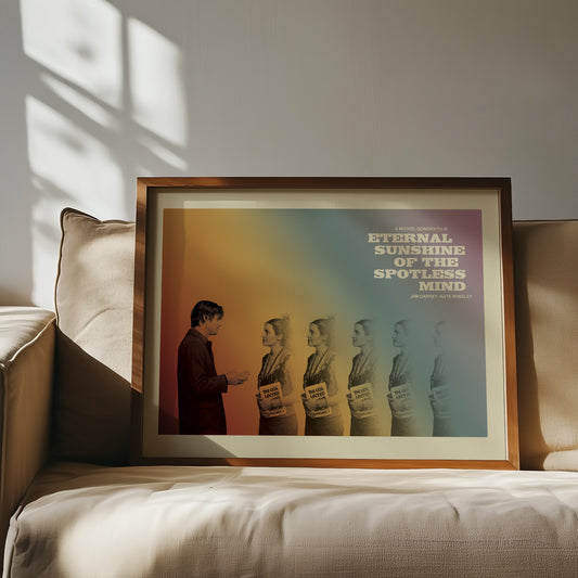 Framed movie poster for 'Eternal Sunshine of the Spotless Mind' on a couch