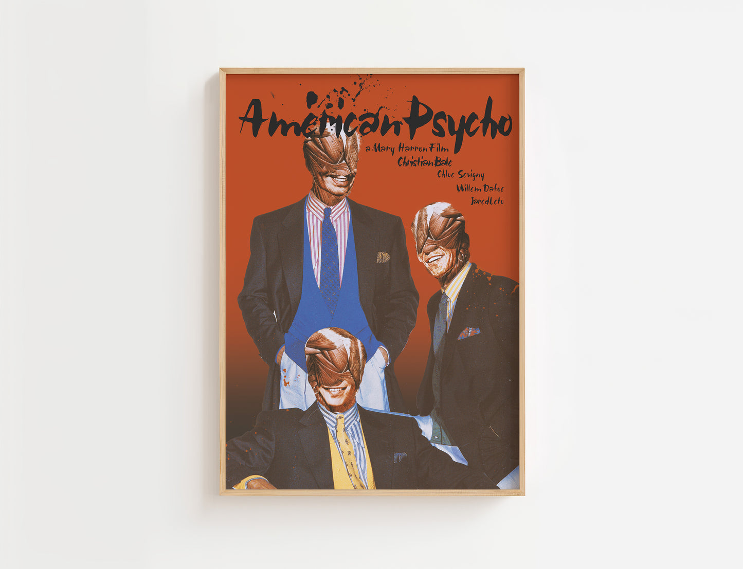 Movie poster for the movie 'American Psycho' with three men in suits and masks on an orange background.
