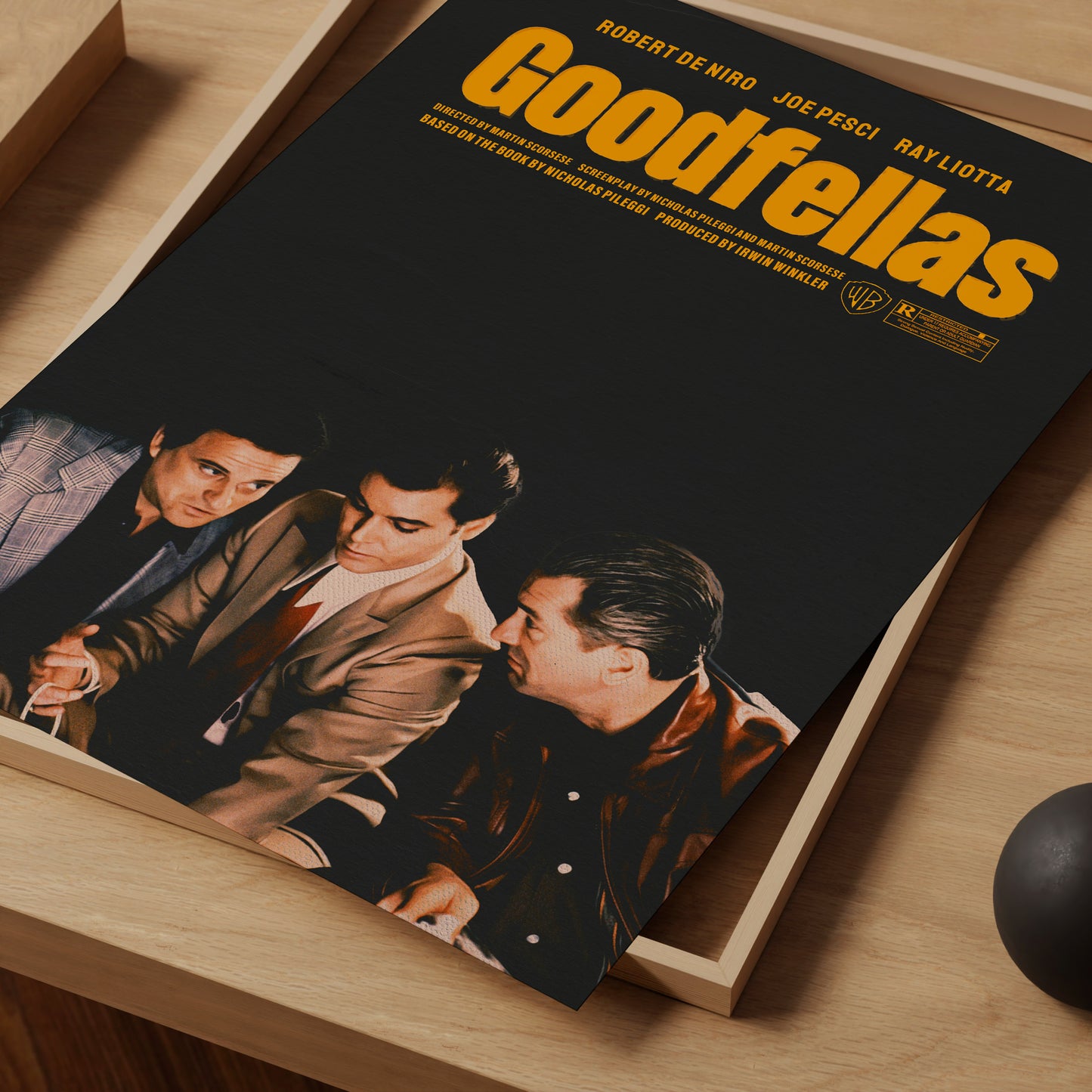 Movie poster for 'Goodfellas' on a wooden surface