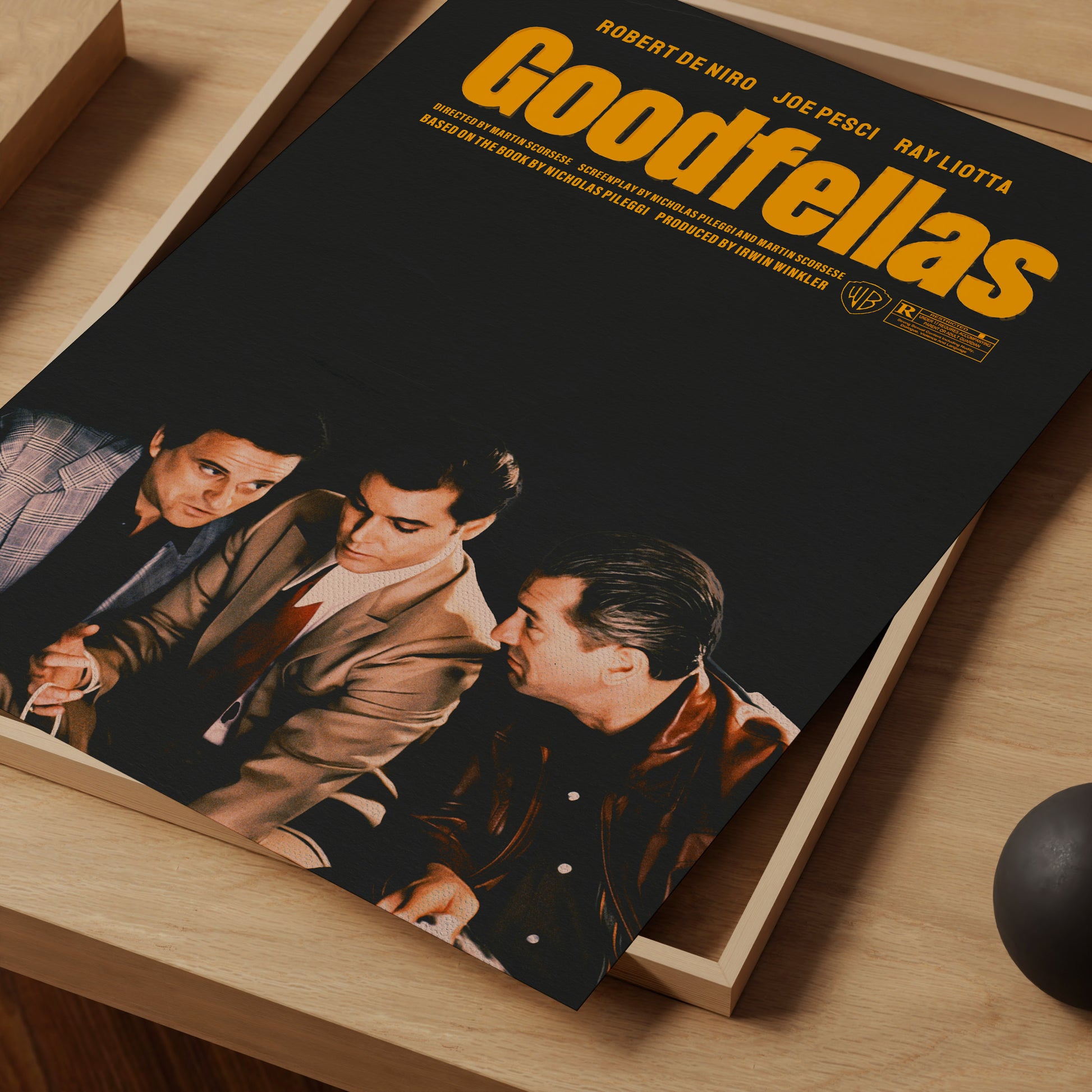 Movie poster for 'Goodfellas' on a wooden surface